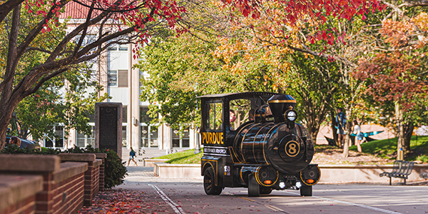 The Boilermaker Xtra Special drives through campus on a fall day