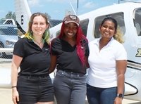 Charity Weke, Ankita Patra and Alex Small with the Piper Archer aircraft they will fly in the 2022 Air Race Classic