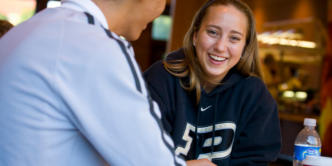 students laughing and studying together